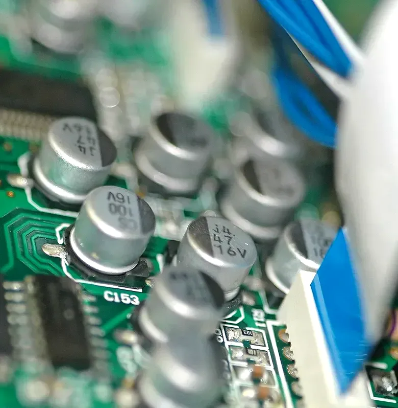 Close-up of surface-mounted capacitors on a printed circuit board