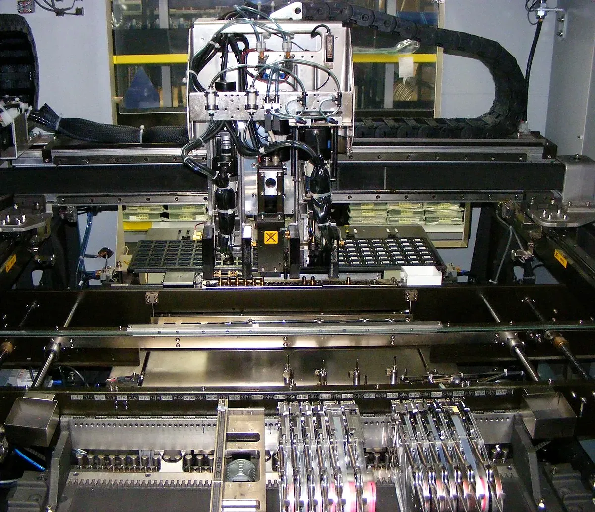 Inside an SMT pick-and-place machine with component feeders